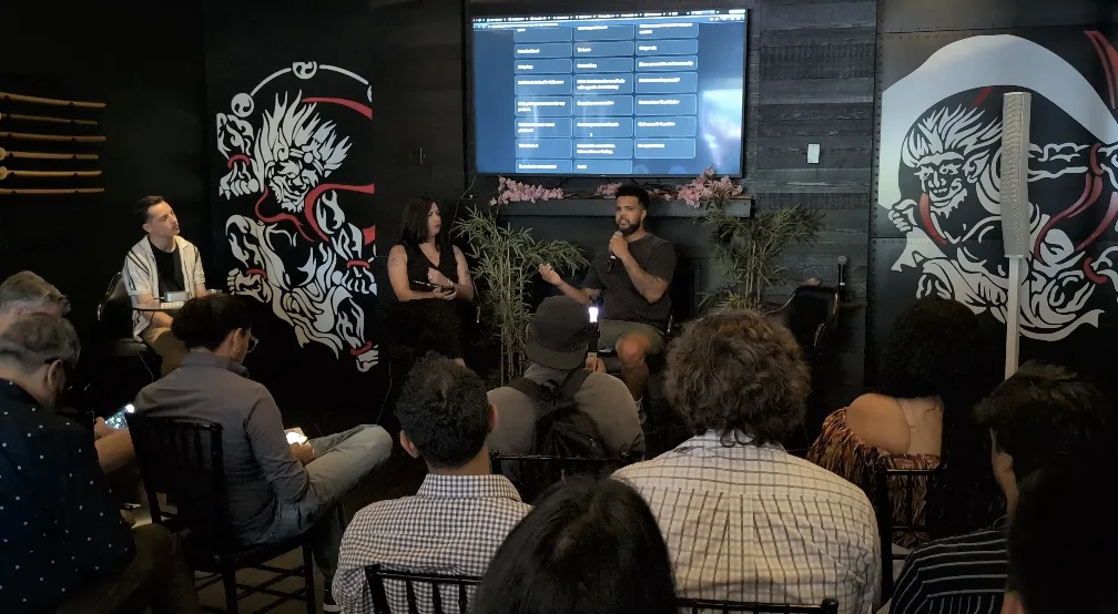 OpenCLE speakers and audience during a live discussion